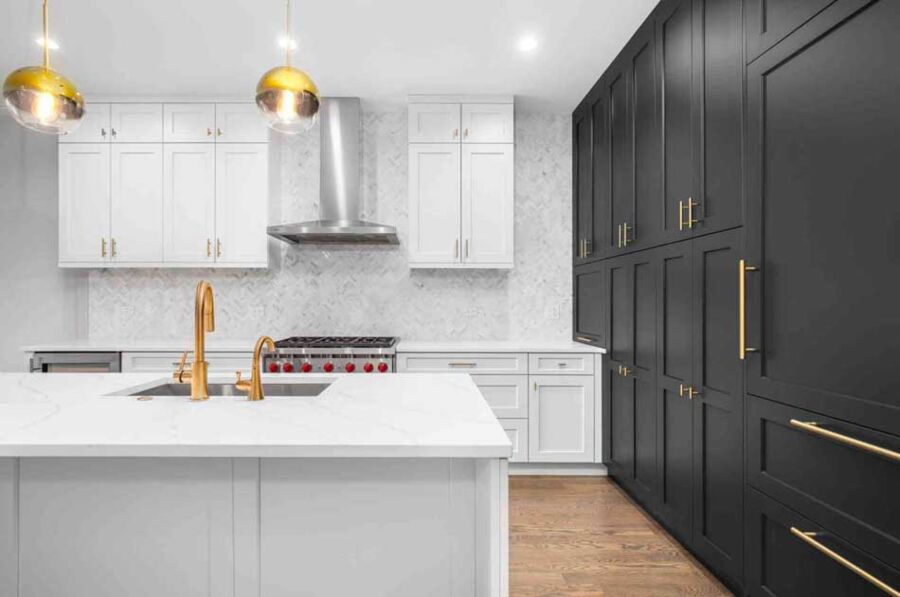 Chimney Hood & Range, San Francisco — Chimney hood mounted and ducted over a gas range in a two-tone kitchen, with the trim fitted square to the cabinet line above.