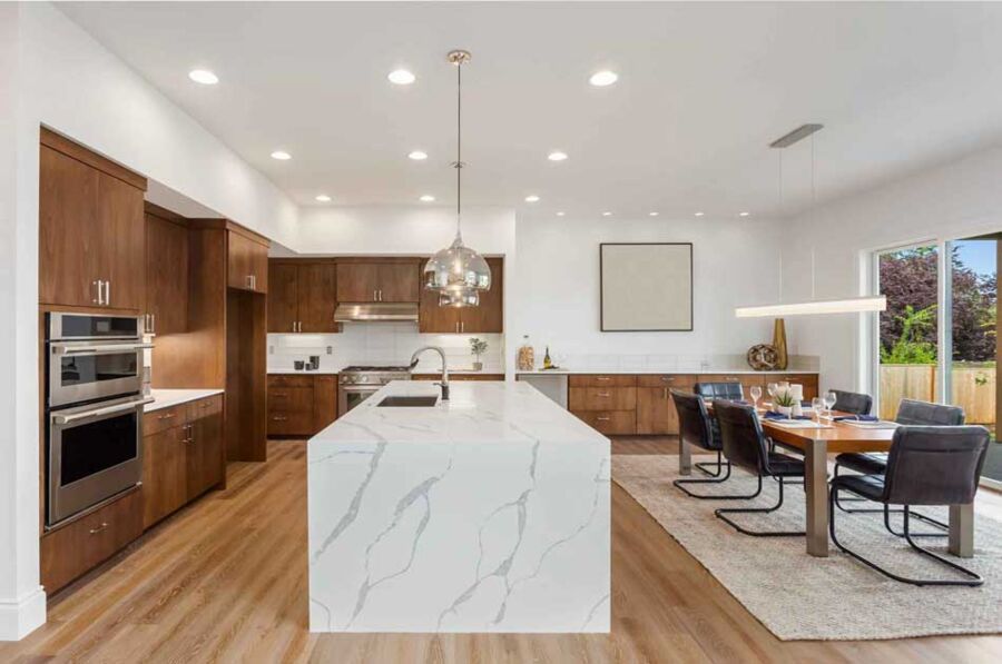 Walnut Kitchen Package, Palo Alto — Stacked wall ovens, an integrated cooktop and full refrigeration installed into a walnut run around a waterfall quartz island.