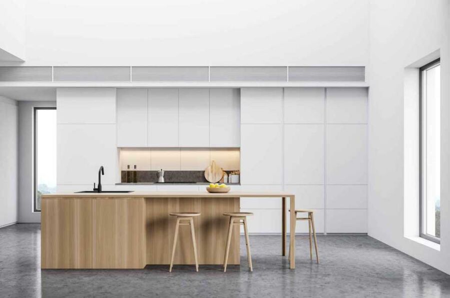 Induction Island, Santa Clara — An induction cooktop dropped into a light oak island on its own dedicated 240V circuit, verified before the unit was unboxed.