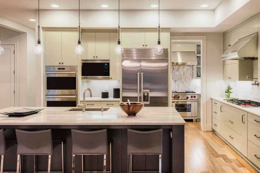 Full Luxury Package, Palo Alto — Built-in refrigerator column, stacked wall ovens and a trim kit microwave set into one cabinet run, with every reveal matched to the millwork beside it.