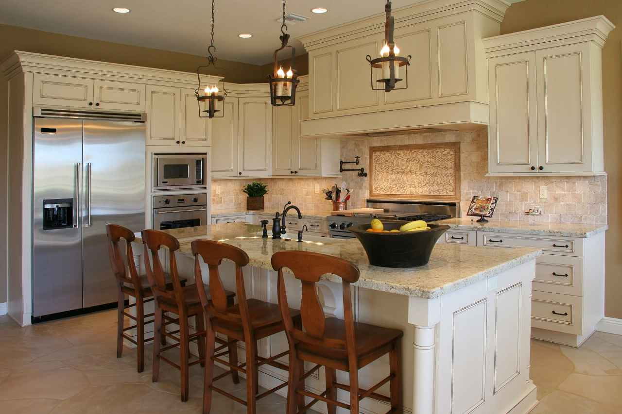 Stainless steel free standing refrigerator in a traditional kitchen